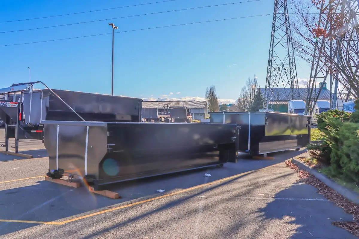 Roll-off dumpster ready for waste disposal at job site for 12 Yard Dumpster Rental in Thomaston